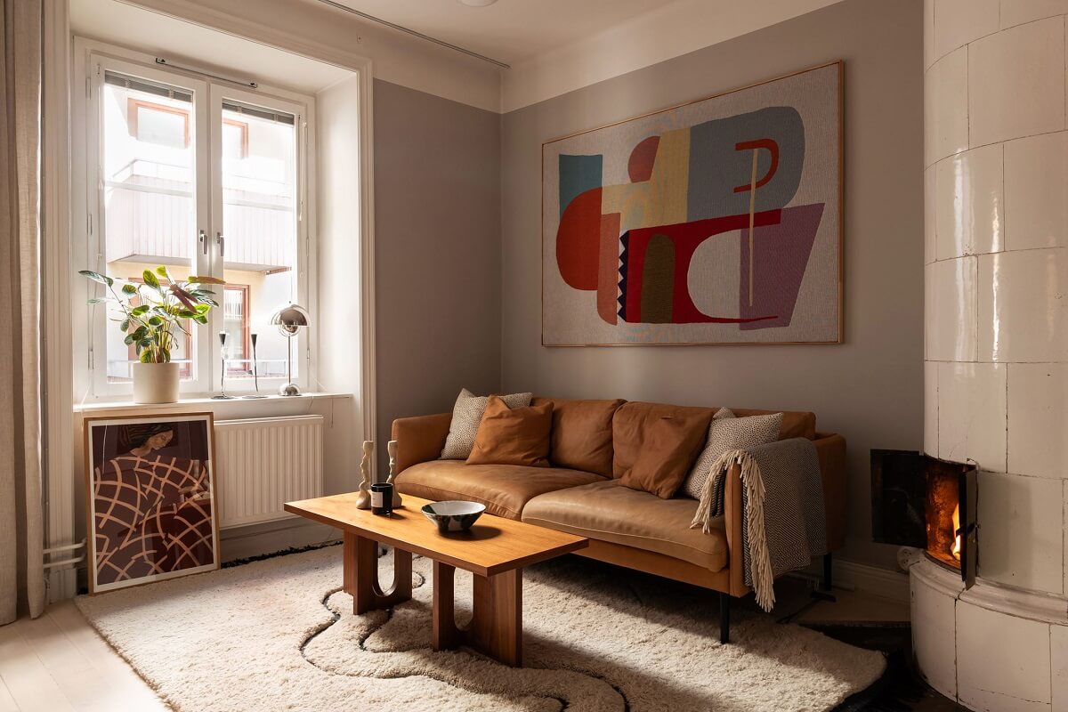 Sober Colors in a Small Renovated Stockholm Apartment 2 gray living room with earthy sofa