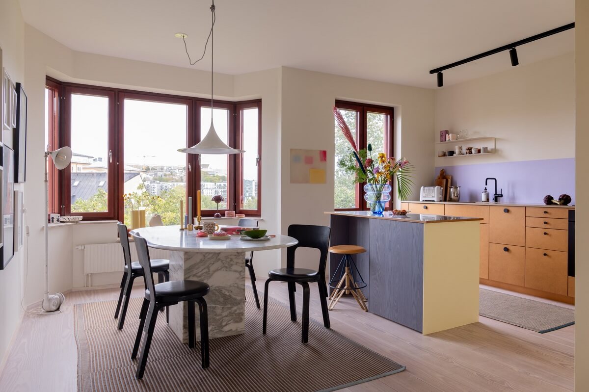 A Light and Modern Stockholm Apartment with Cheerful Color Accents 1 modern kitchen and dining area