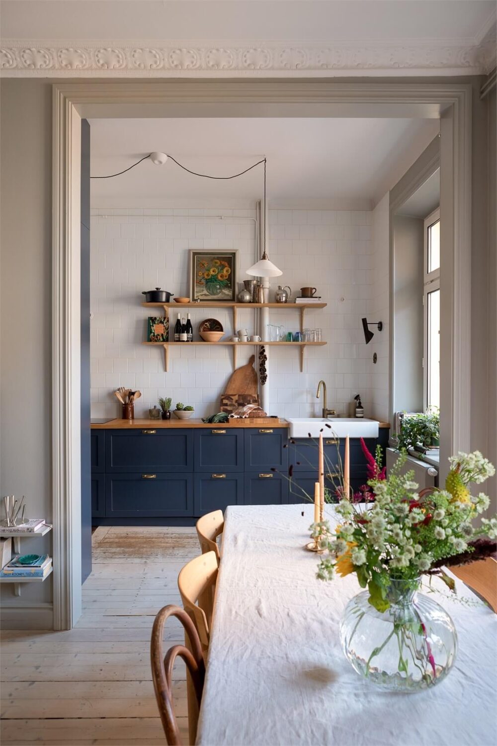 A Turn-of-the-Century Apartment with a Dark Blue Bedroom - Revisited 11 open floor plan living room kitchen