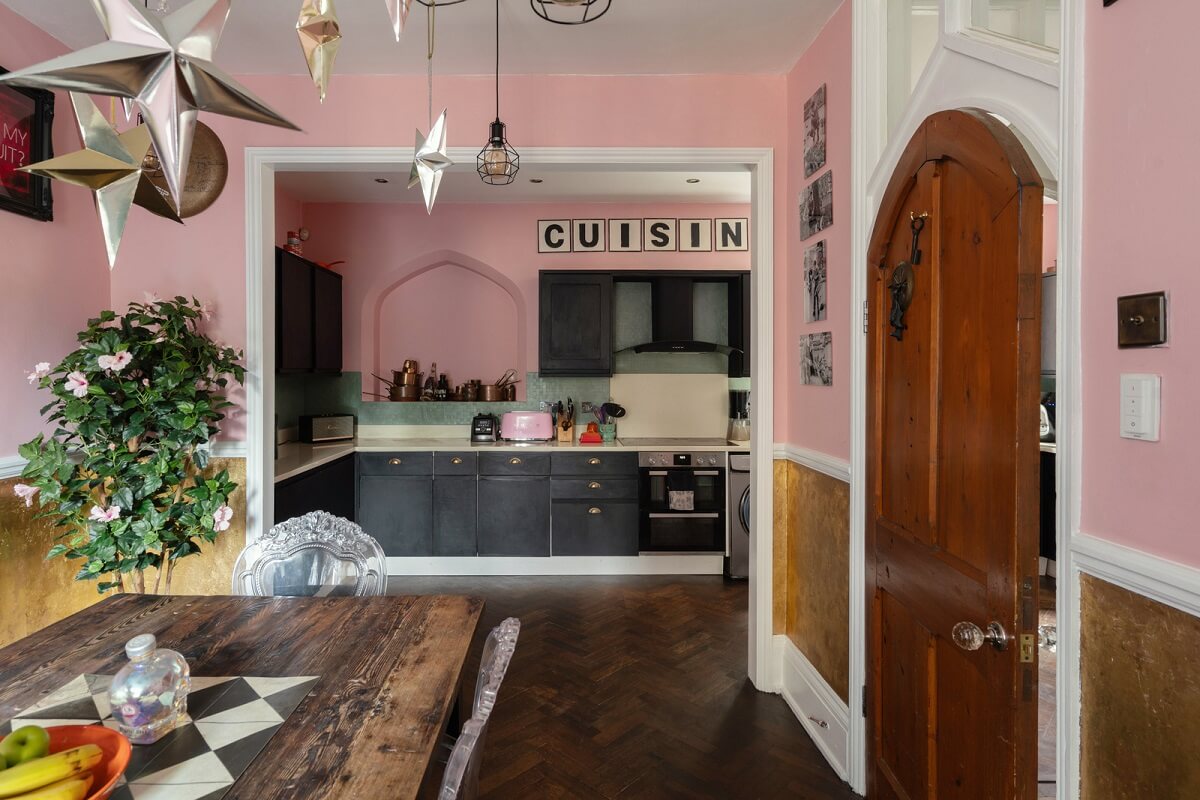 A Colorful Gothic-Style School Conversion in England 1 pink open plan dining room kitchen