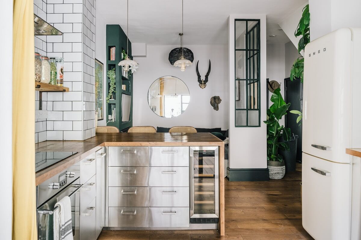 A Charming One-Bedroom Apartment with a Courtyard Terrace 2 stainless steel kitchen in open plan living space