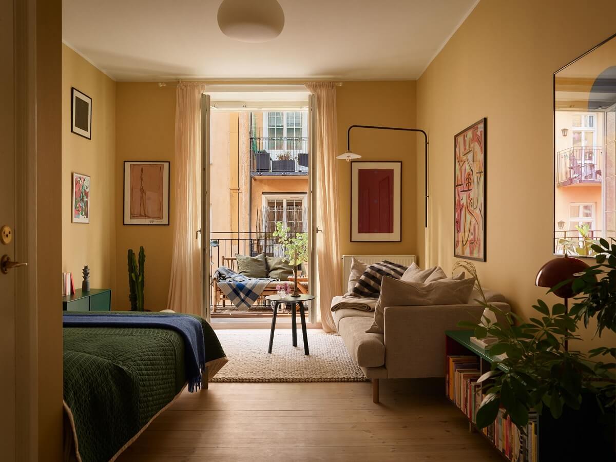 Golden Yellow Walls in a Colorful Swedish Studio Apartment 1 studio apartment golden yellow walls nordroom