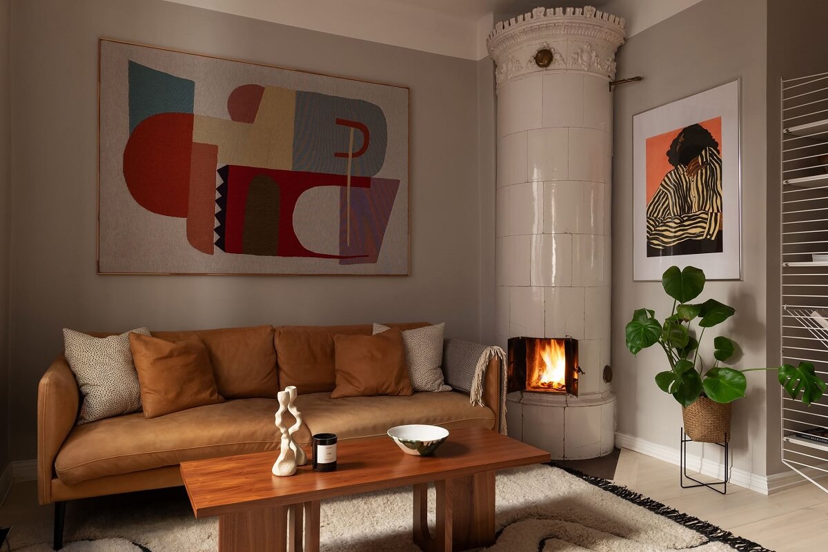 Sober Colors in a Small Renovated Stockholm Apartment 1 warm light brown sofa