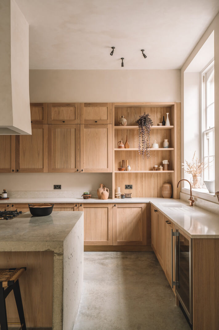 Contemporary Interiors with Limewash Walls in an Old School Building 3 wooden kitchen with open cabinet in the corner