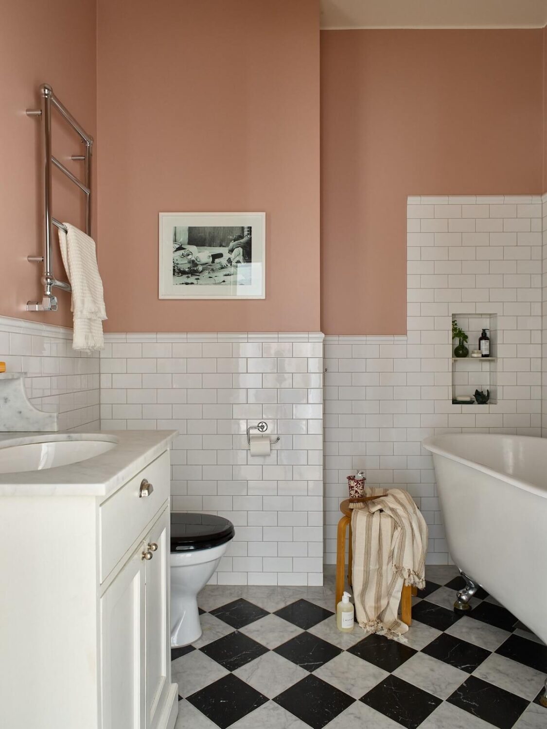 A Colorful Turn-of-the-Century Family Apartment in Stockholm 28 bathroom pink walls black an white checkerboard floor and bath
