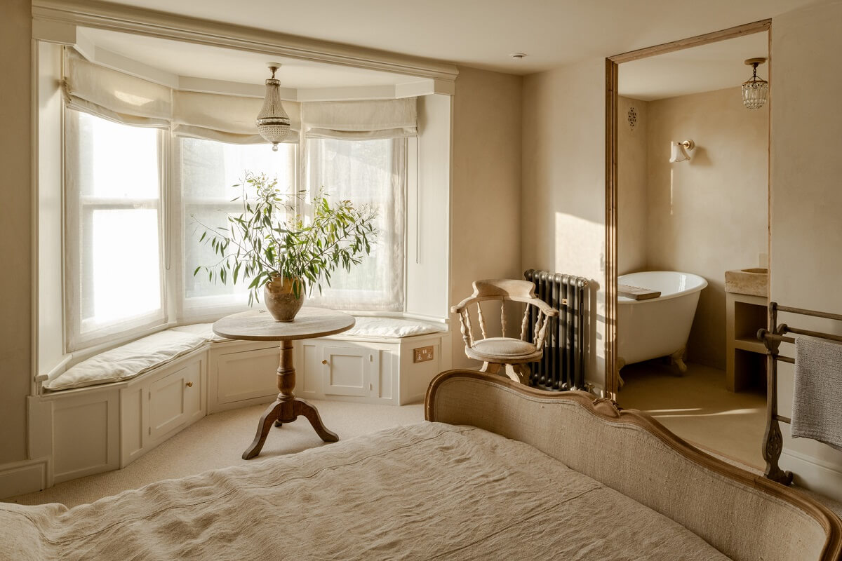 Limewash Walls and Restored Period Features in a Calm English Home 12 bedroom with limewash wallsbay window and en suite bathroom