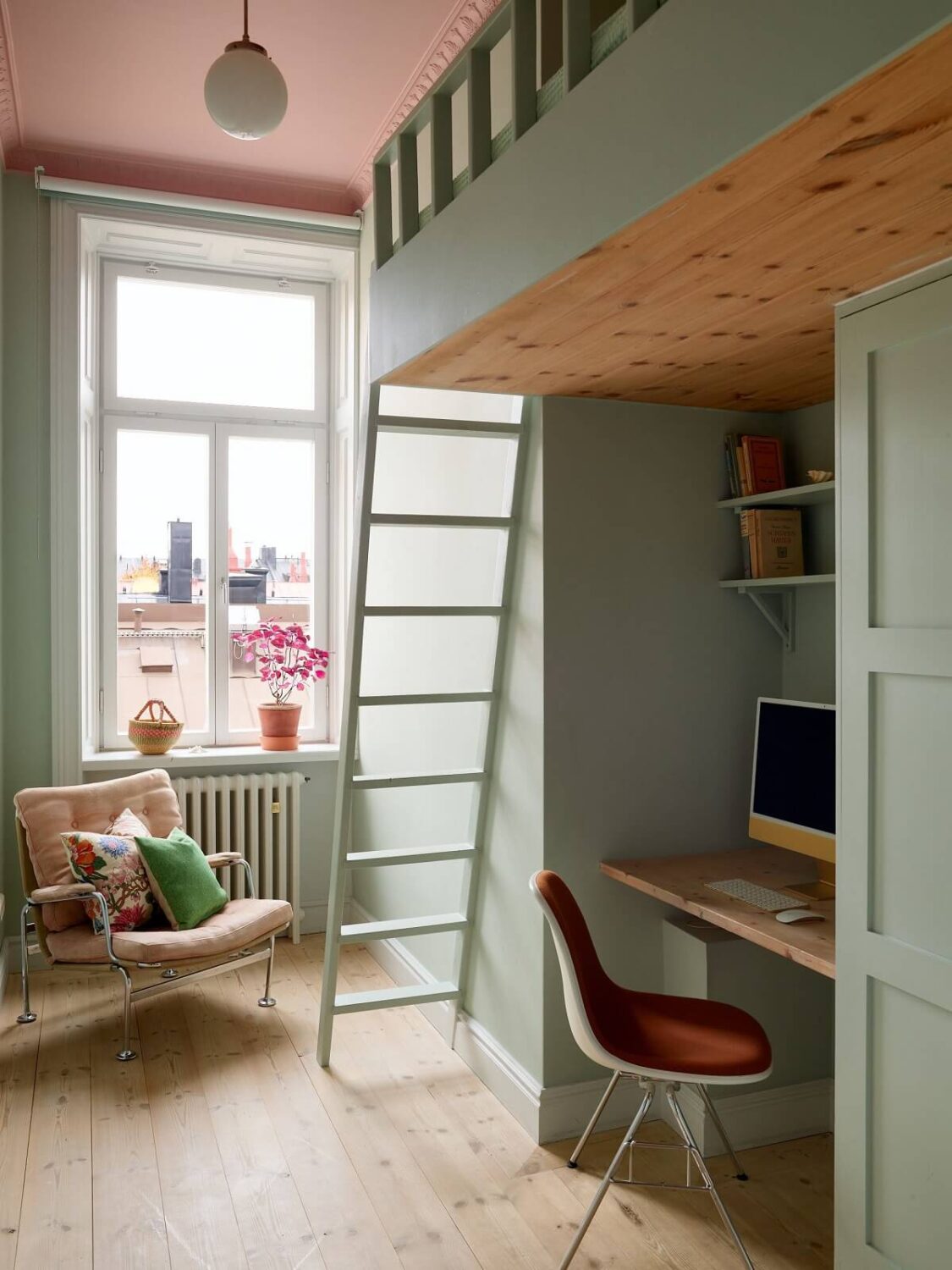 A Colorful Turn-of-the-Century Family Apartment in Stockholm 32 bedroom with loft bed desk and pink painted ceiling