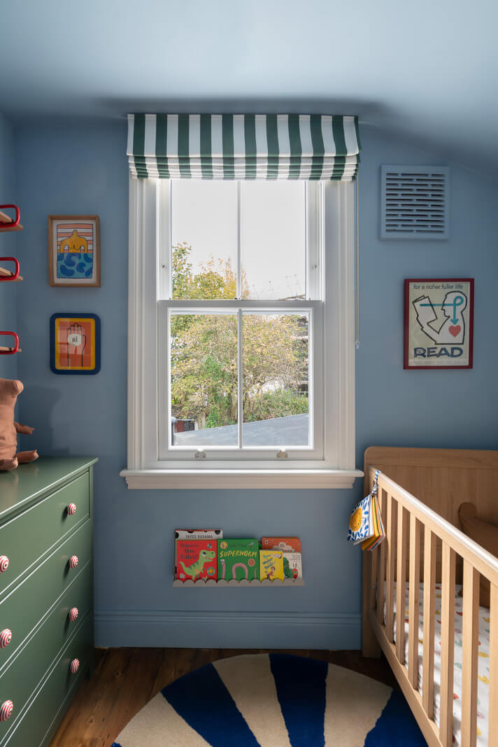 Colorful Rooms and Period Features in a London Terrace House 17 blue nursery with striped curtains