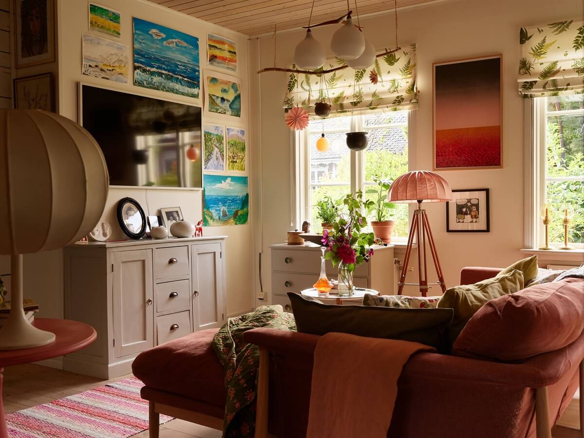 A Charming Swedish Cottage Filled with Art and Color 1 color and patterns living room pink sofa