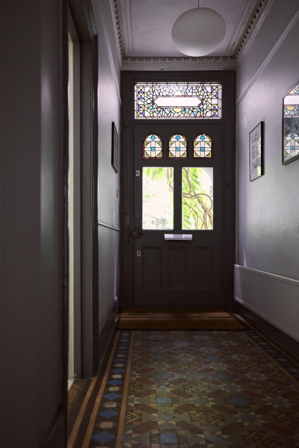 A Grand Victorian House with Many Period Features and a Lush Garden 12 gray hallway with original floor tiles