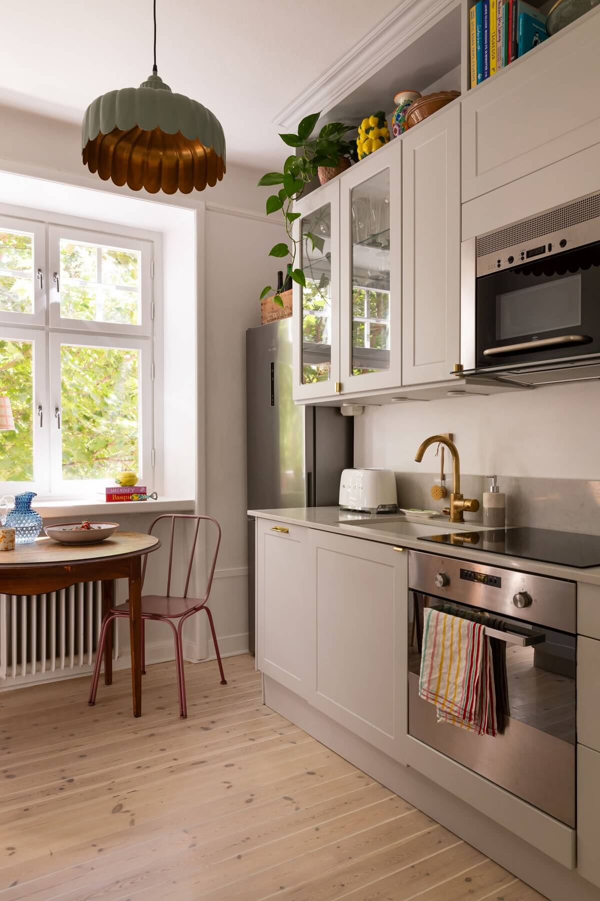 gray kitchen with storage space aboce upper cabinets