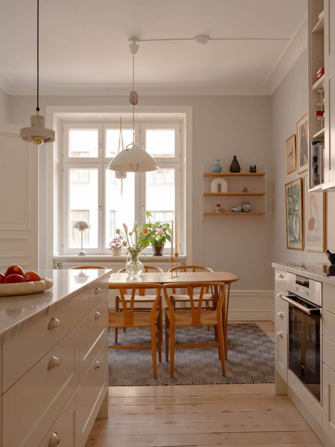 A Spacious Stockholm Apartment with Light Gray Walls 10 light kitchen with large table
