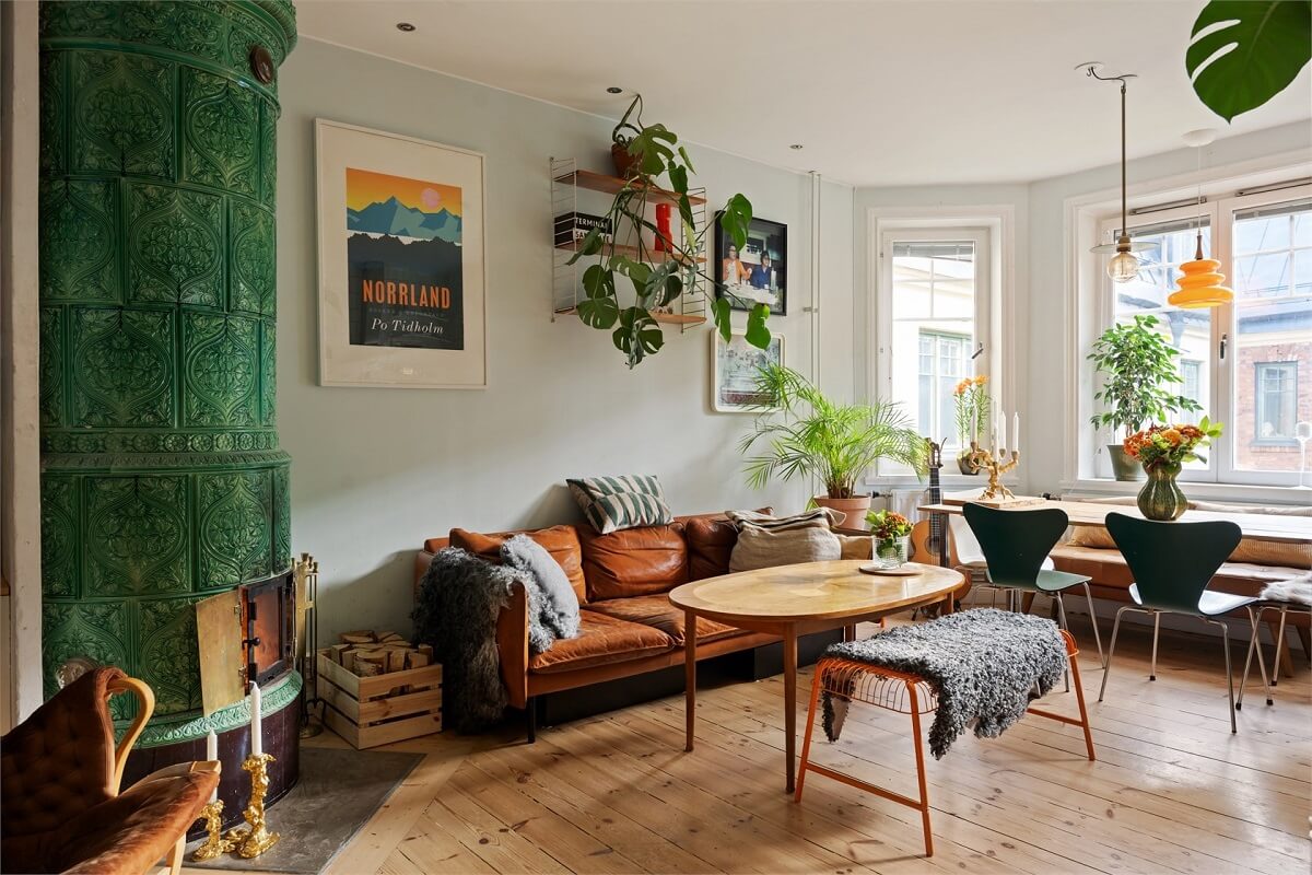 Green Tones in a Turn-of-the-Century Stockholm Apartment 1 living room wooden floor green fireplace