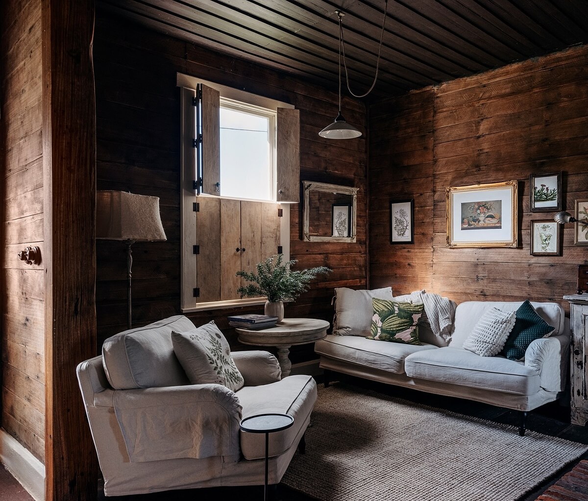 A Cozy Rustic Shipbuilder's Cottage in Northern Tasmania 1 log house living room wooden walls and ceiling