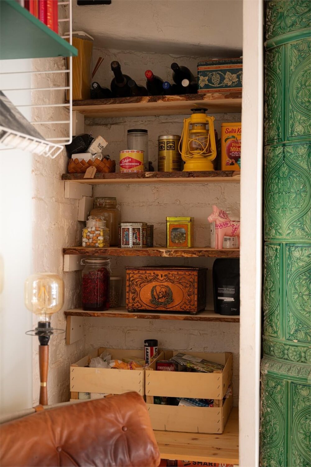 Green Tones in a Turn-of-the-Century Stockholm Apartment 11 niche with storage shelves
