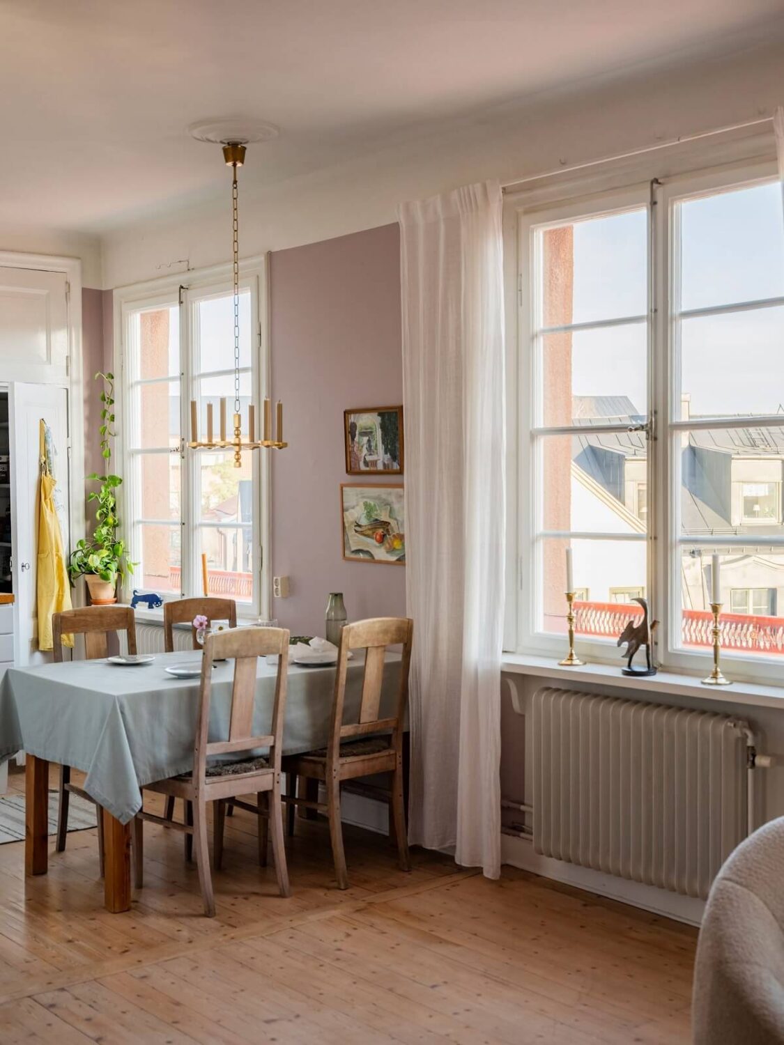 A Living Room with Light Purple Walls in a Swedish Apartment 5 open plan living room and kitchen