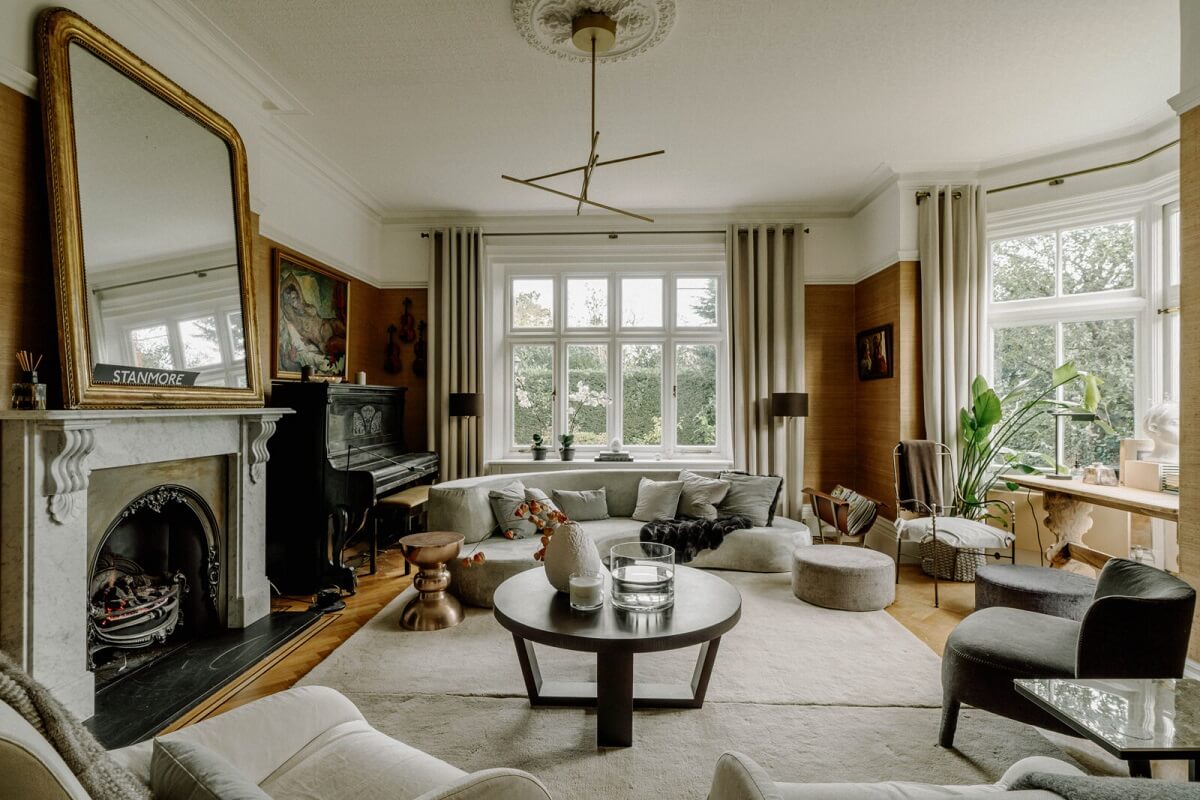 A Grand Arts and Crafts House in London 1 spacious living room rounded furniture fireplace
