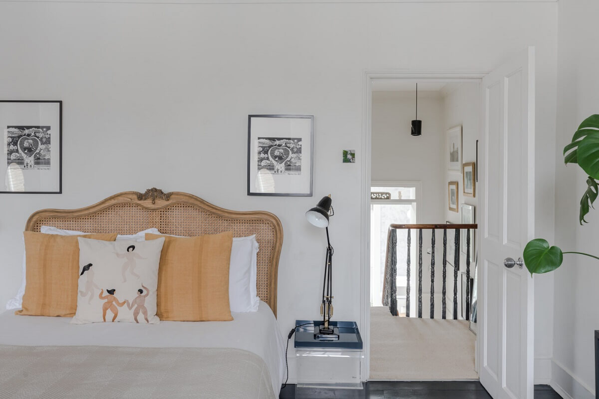 A Bright Extended and Renovated Victorian House in London 15 white bedroom with cane headboard