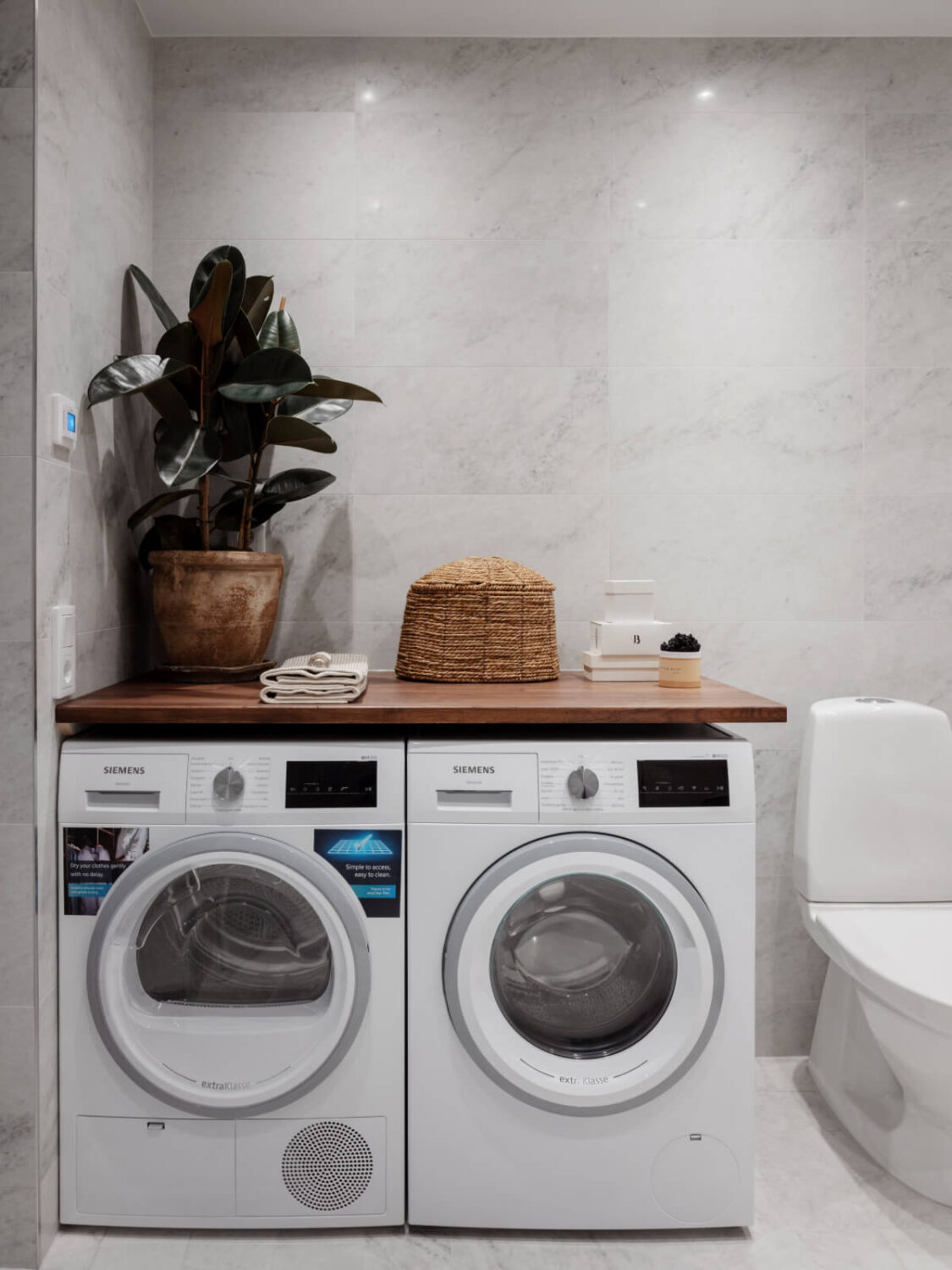 A Calm and Contemporary Apartment in a Former Office Space 24 bathroom with washer and dryer