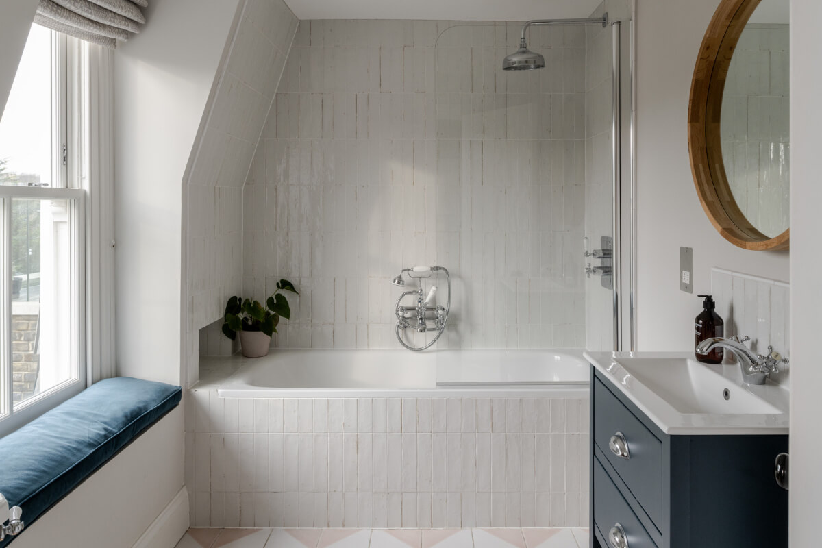 A Beautiful Extended Victorian Family Home in London 20 bathroom with window seat and shower bath combo nordroom
