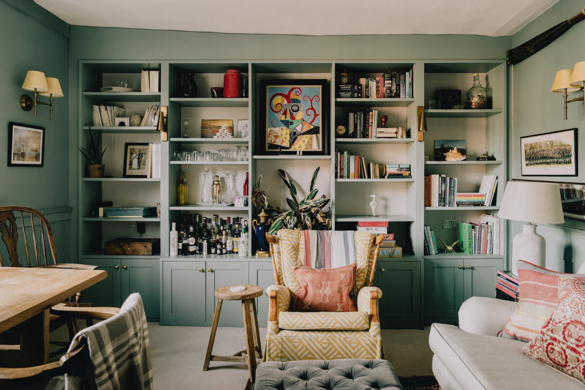 Countryside Charm in a London Apartment in a Former Ale House 1 booksheves in small green living room nordroom