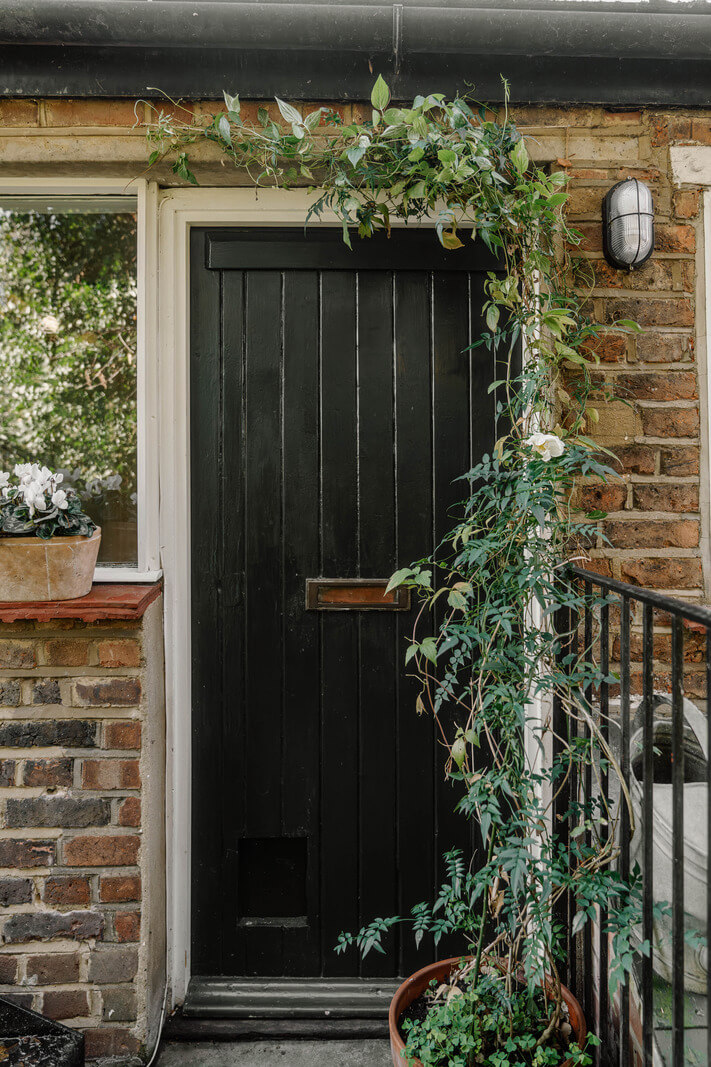 French and Midcentury Influences in a Charming London Studio Apartment 15 front door studio apartment French and Midcentury Influences in a Charming London Studio Apartment
