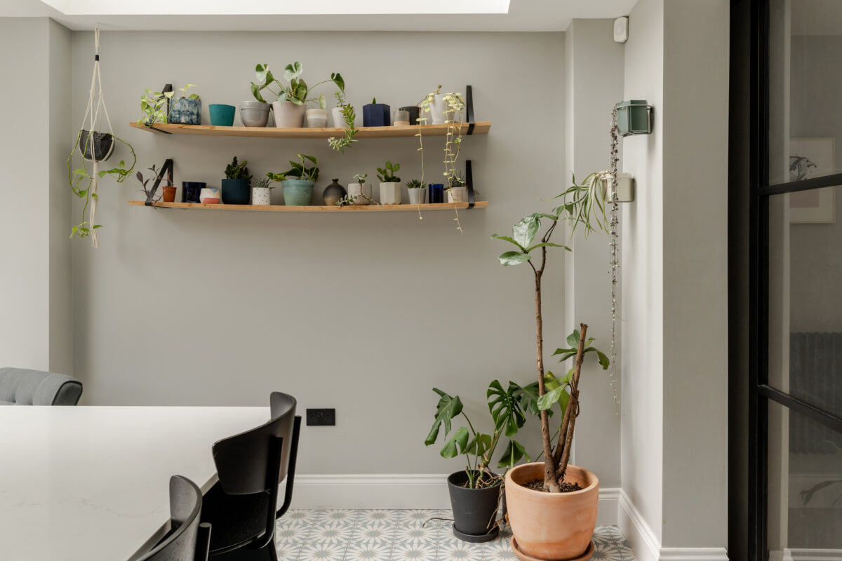 A Beautiful Extended Victorian Family Home in London 5 gray dining room with wooden shelves
