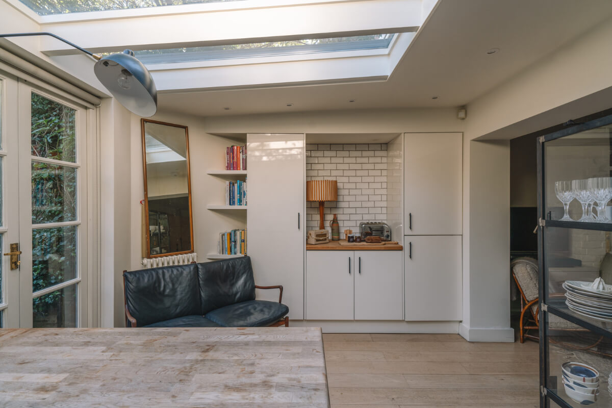 A Charming Garden Apartment in North Kensington 11 kitchen with black sofa