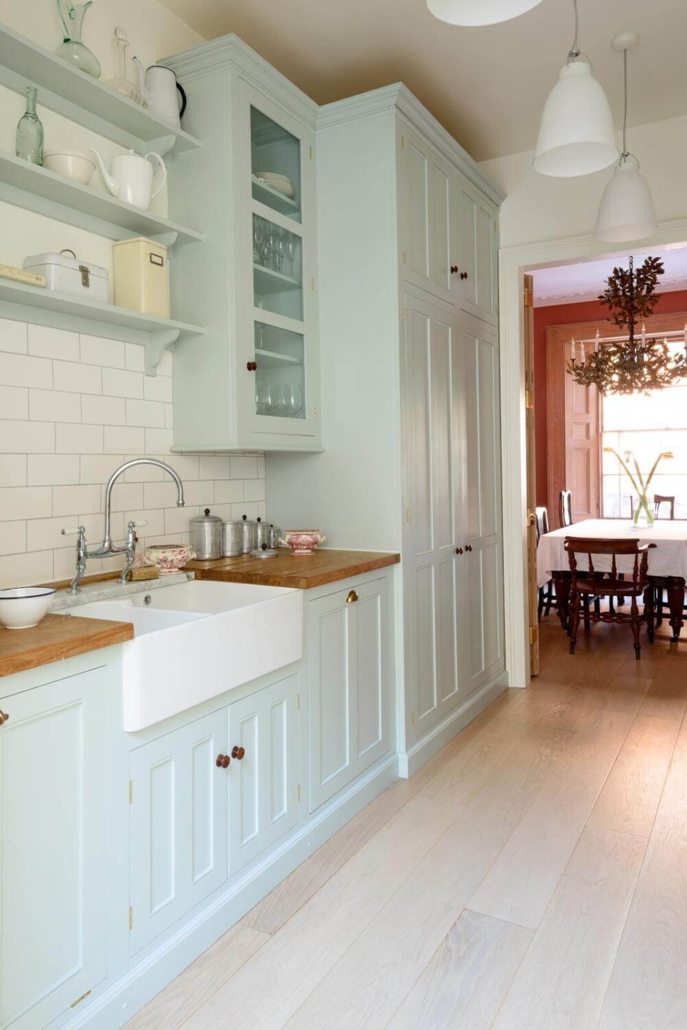 The Pros and Cons of a Wooden Kitchen Countertop 29 pale blue galley kitchen with wooden countertop nordroom