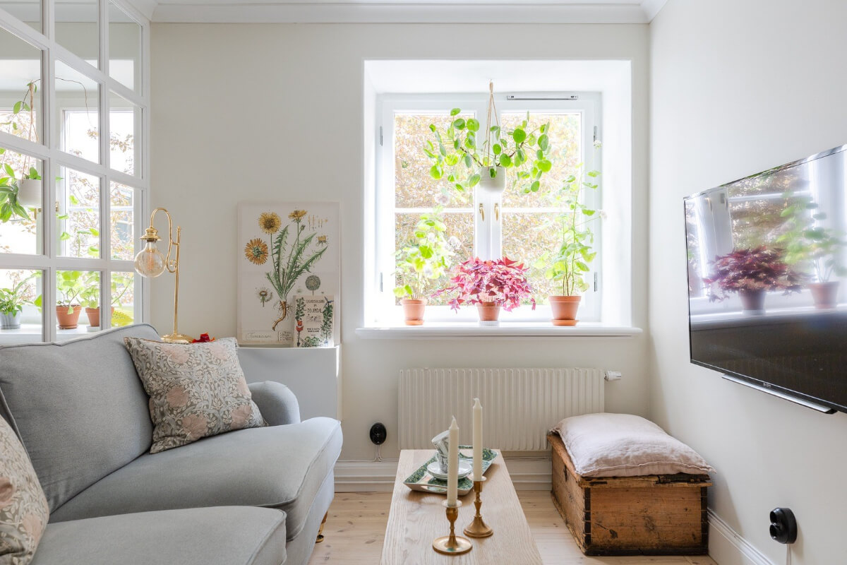 A Small and Bright Two-Bedroom Apartment in Stockholm 1 tiny scandi living room with plants