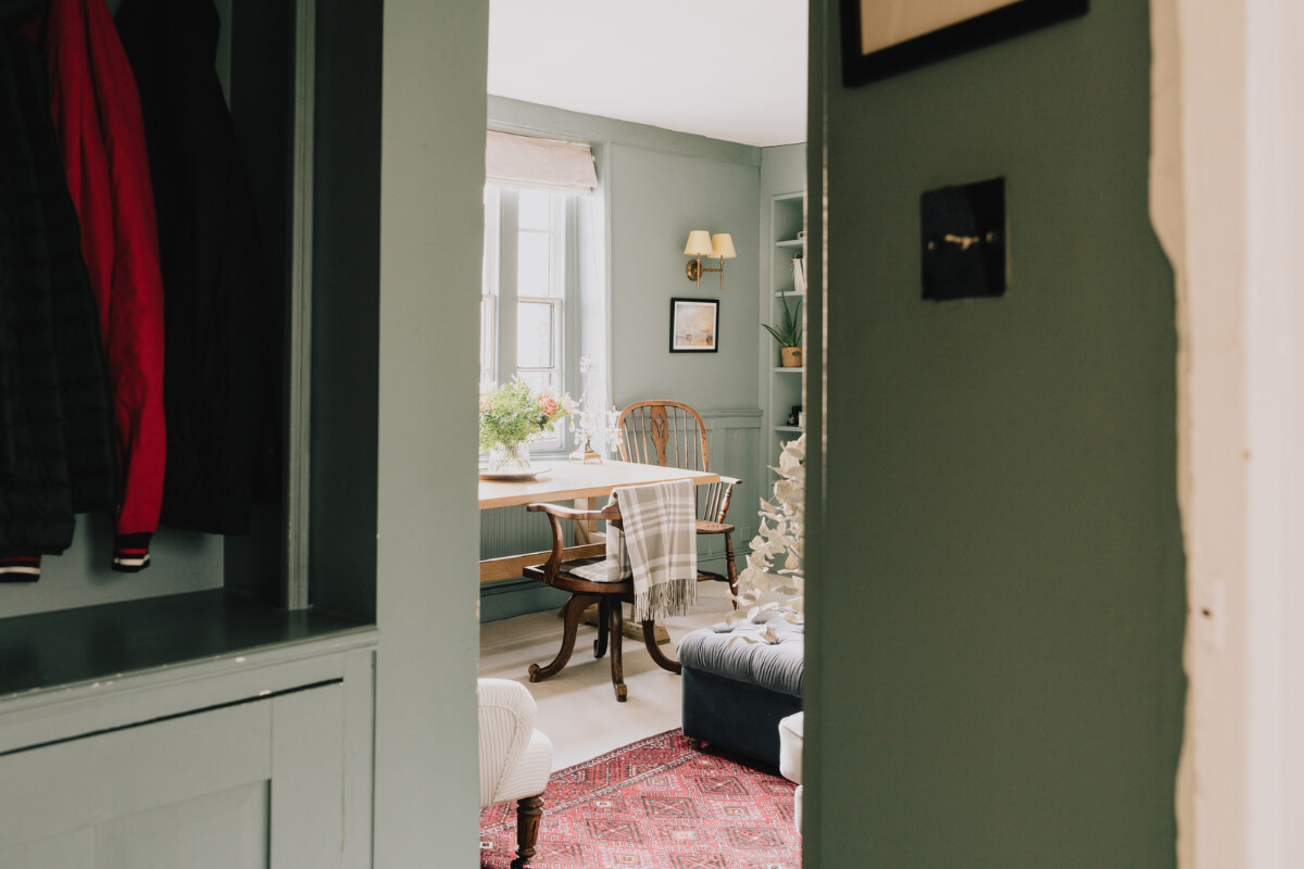 Countryside Charm in a London Apartment in a Former Ale House 10 view into small green living room