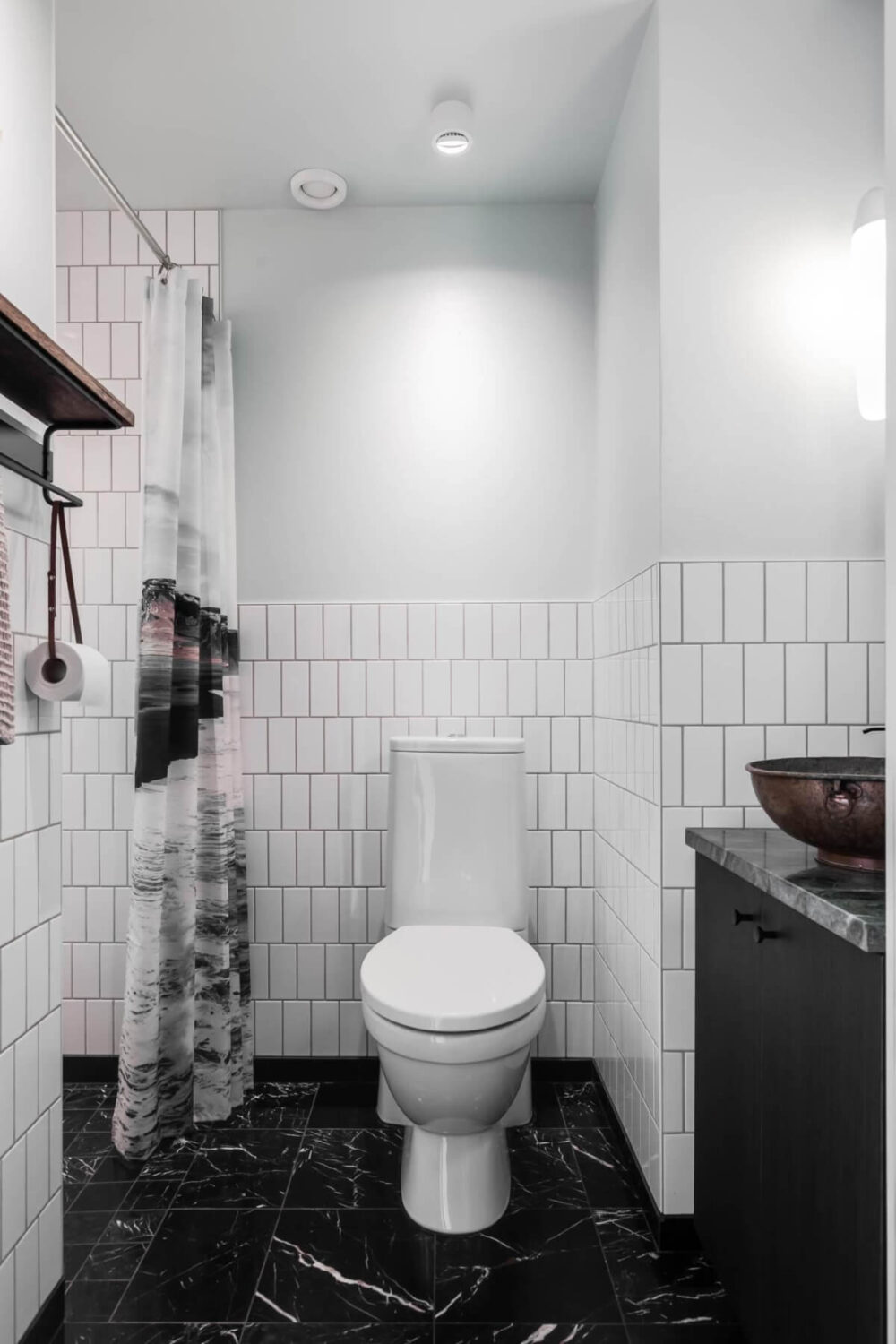 A Swedish Architectural Villa Surrounded by Nature 20 bathroom black marble floor white tiles