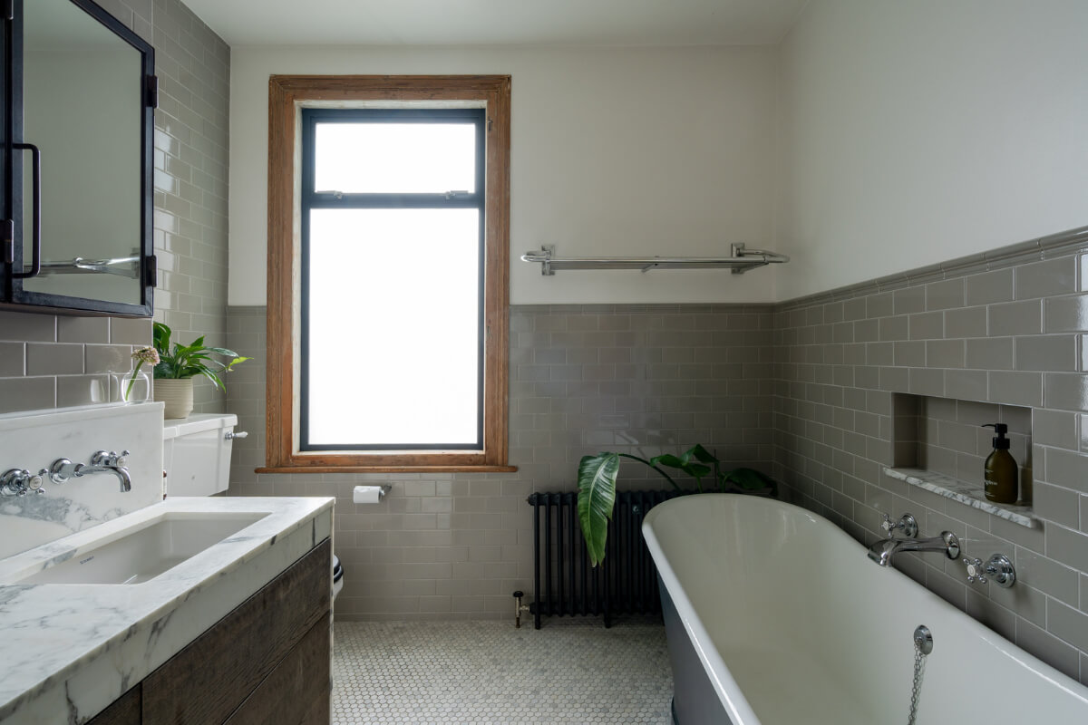 A Restored Victorian House with Exposed Brick and a Kitchen Extension 18 bathroom gray subway tiles marble sink