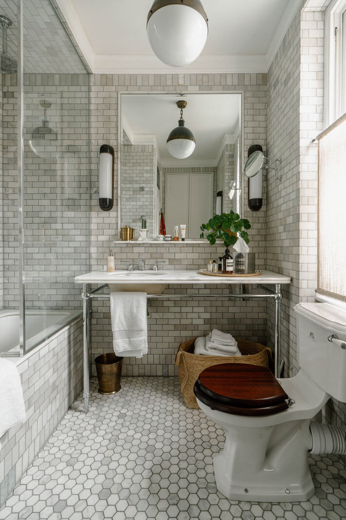 A Cozy Art-Filled Attic Apartment in London 14 bathroom gray tiled marble sink