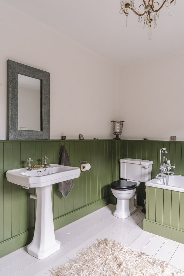 A Beautiful Renovated Country House in England 19 bathroom green paneling wooden floor
