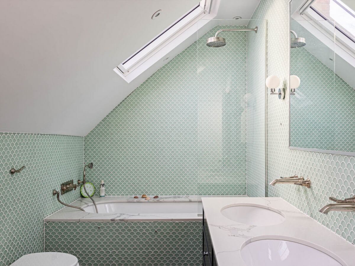 An Extended Family Home in London with Pink Crittall Doors 15 bathroom green tiles slanted ceiling