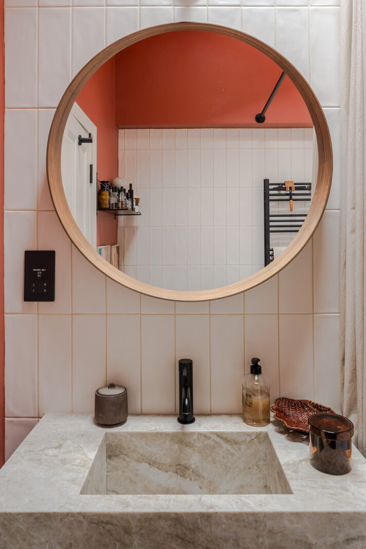 Cozy Contemporary Spaces in a Light-Filled Victorian Apartment 21 bathroom sink round mirror