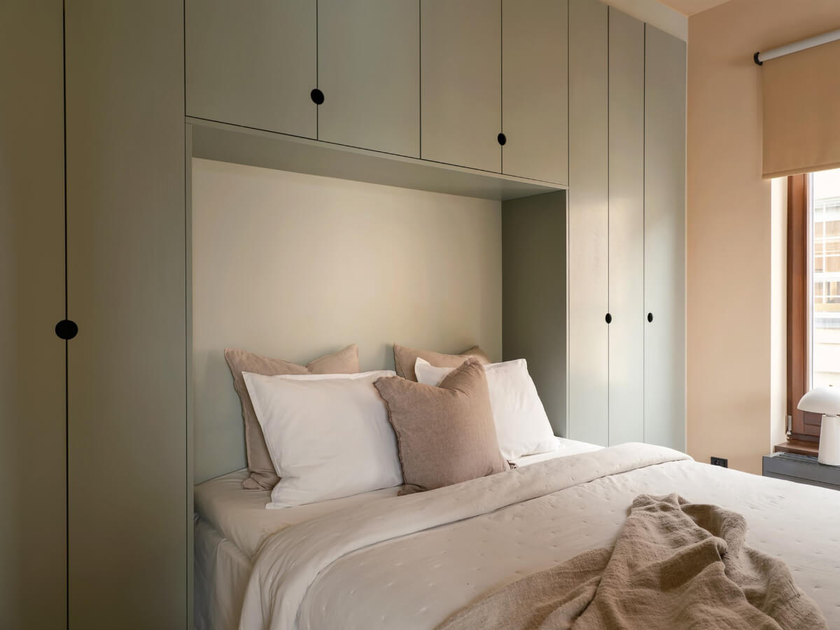 A Small Modern Stockholm Apartment with Smart Storage Solutions 7 bed surrounded by wardrobes