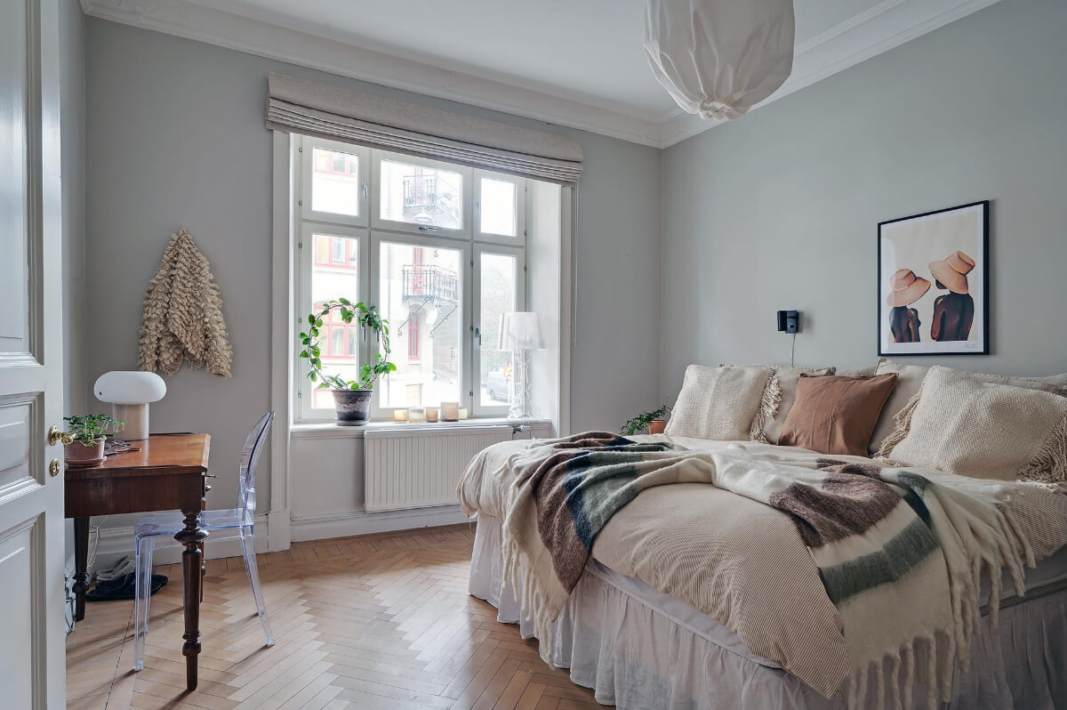 A Swedish Apartment with an Open Living Space and Period Features 21 bedroom herringbone parquet floor desk