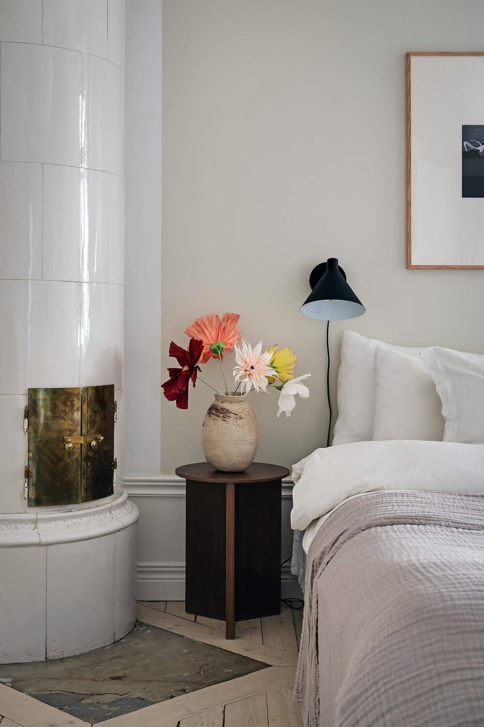 Period Features and Modern Materials in a Swedish Apartment 21 bedroom nightstand fireplace