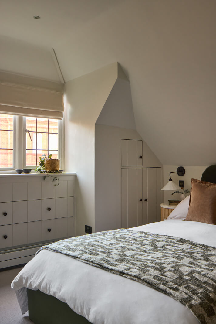 A Stunning Victorian House with Period Features and Surprising Spaces 23 bedroom slanted ceiling built-in storage space