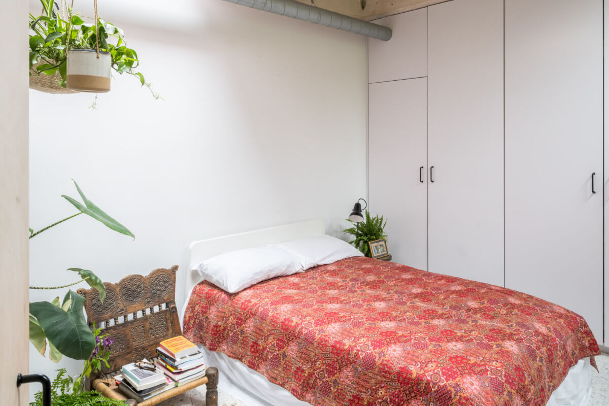 A Unique House in London with Plant-Filled Interiors and a Lush Garden 12 bedroom with plants and built-in wardrobes