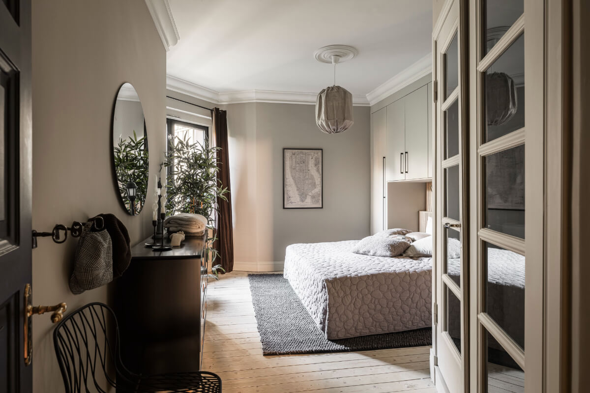 A Swedish Apartment with Exclusive Materials and Monochrome Color Scheme 17 bedroom wooden floor wardrobes around bed