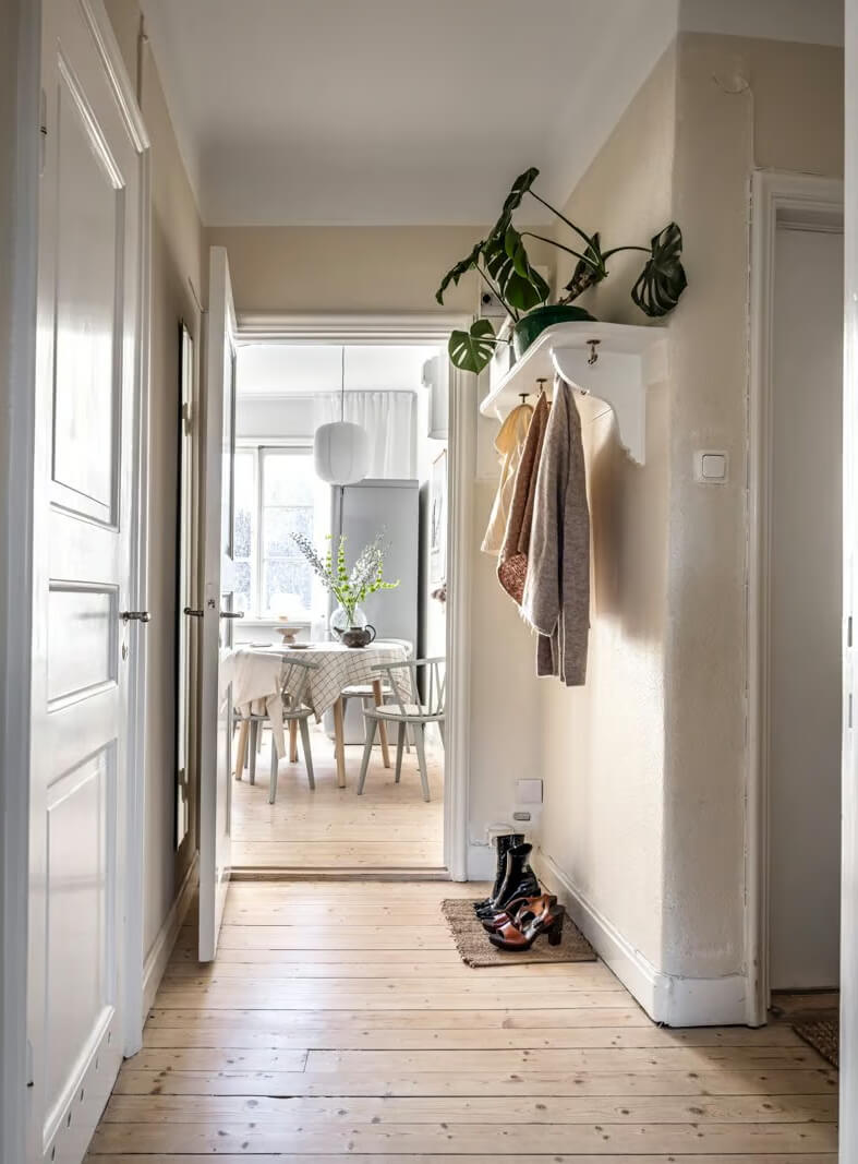 A Beige Studio Apartment with a Bright Kitchen 12 beige hallway with coat storage