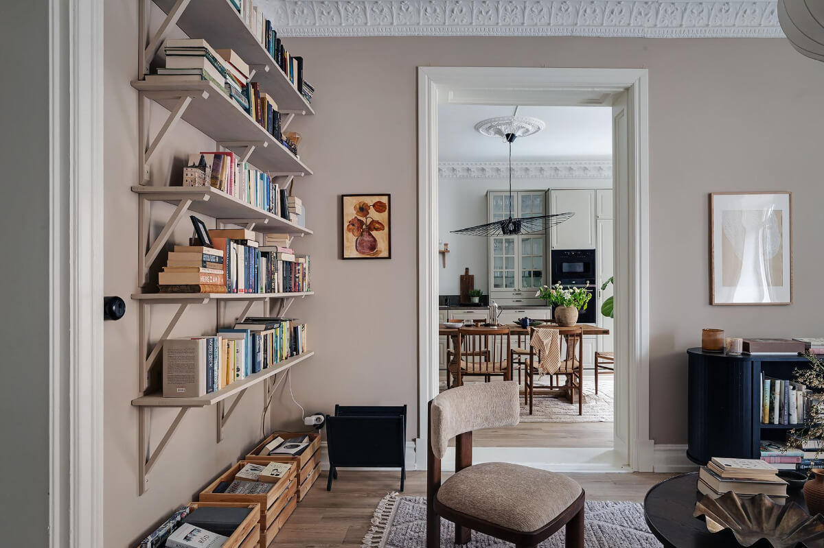 Warm and Inviting Rooms in a Renovated Swedish Apartment 10 bookshelves and views of kitchen