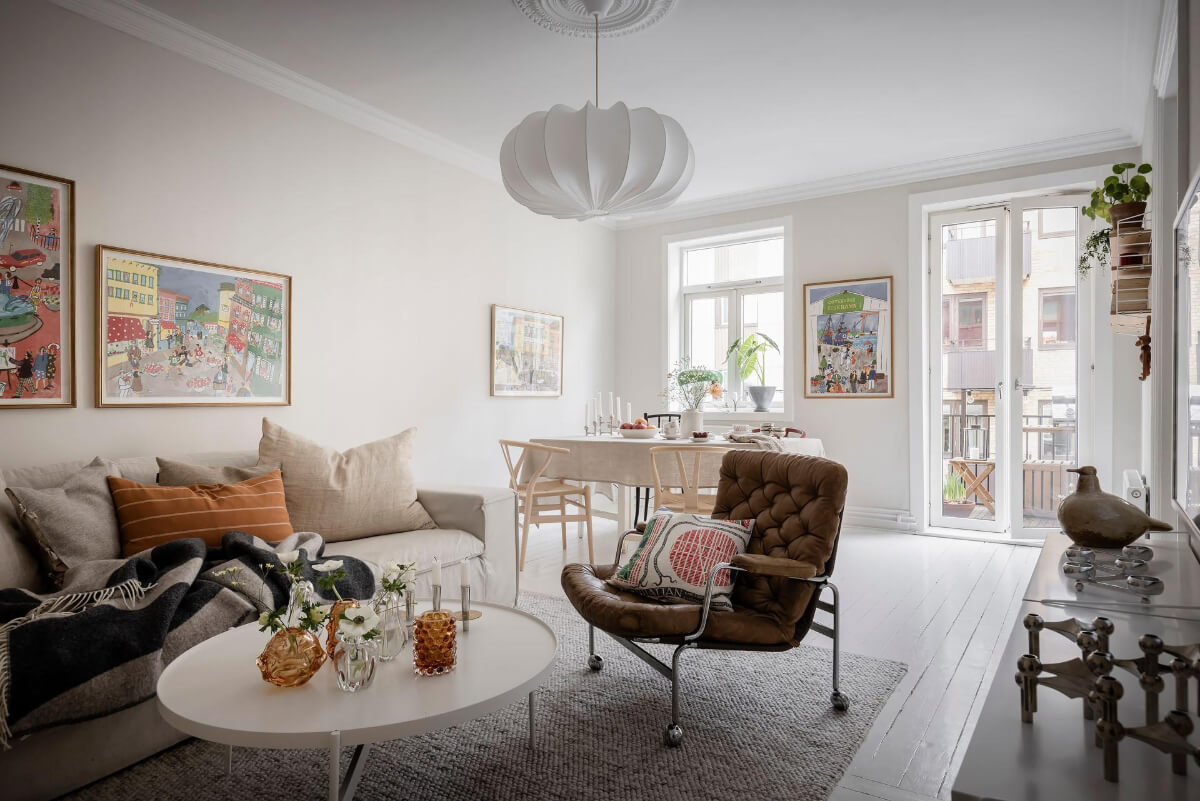 White-Painted Floorboards in a Turn-of-the-Century Apartment 1 bright scandi living room