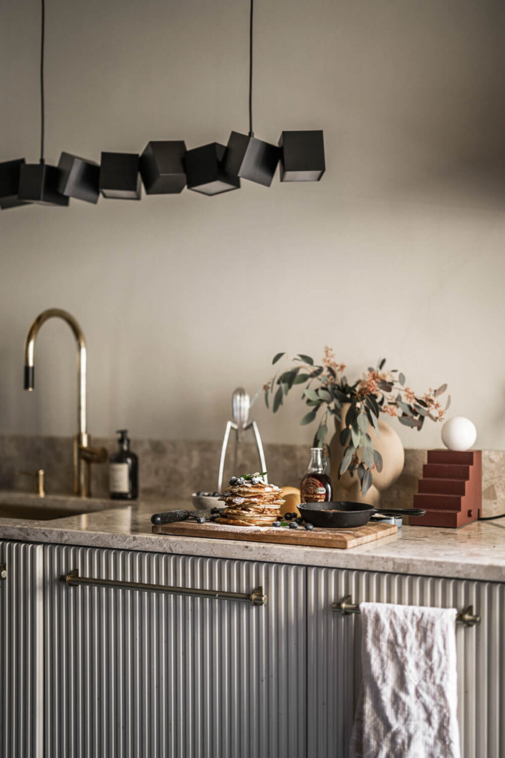 A Swedish Apartment with Exclusive Materials and Monochrome Color Scheme 8 classic kitchen design lamps