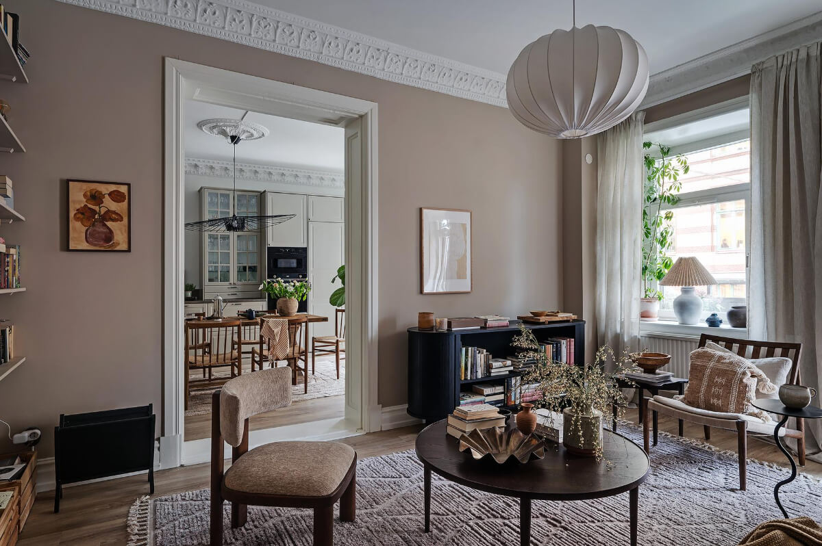 Warm and Inviting Rooms in a Renovated Swedish Apartment 6 cozy lviving room large rug warm wall color