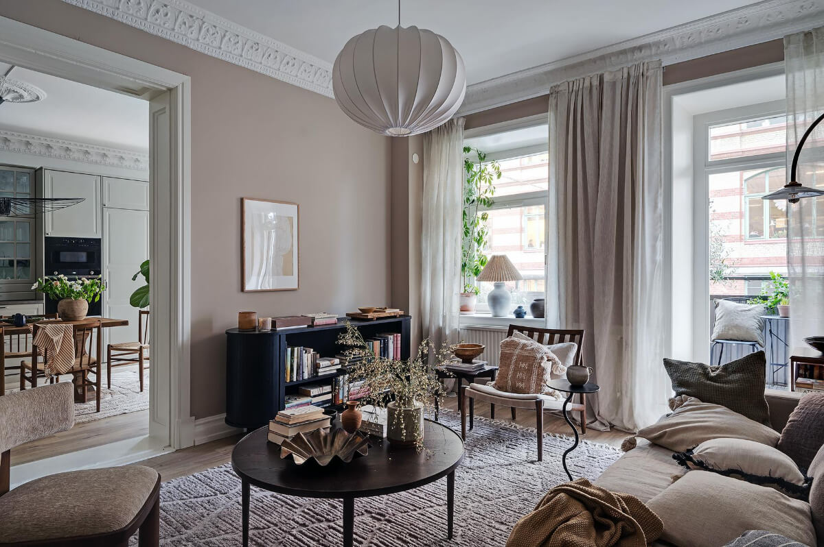 Warm and Inviting Rooms in a Renovated Swedish Apartment 1 cozy scandi living room with balcony