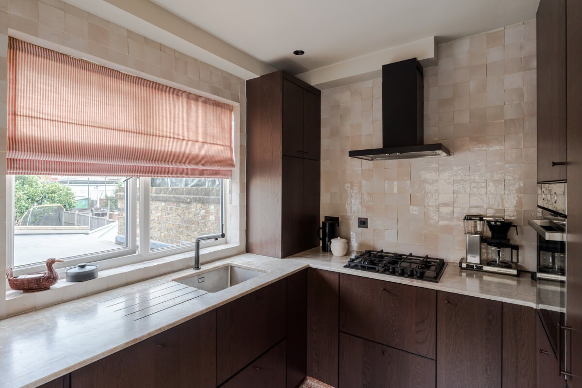 Cozy Contemporary Spaces in a Light-Filled Victorian Apartment 15 dark wwooden kitchen marble countertop